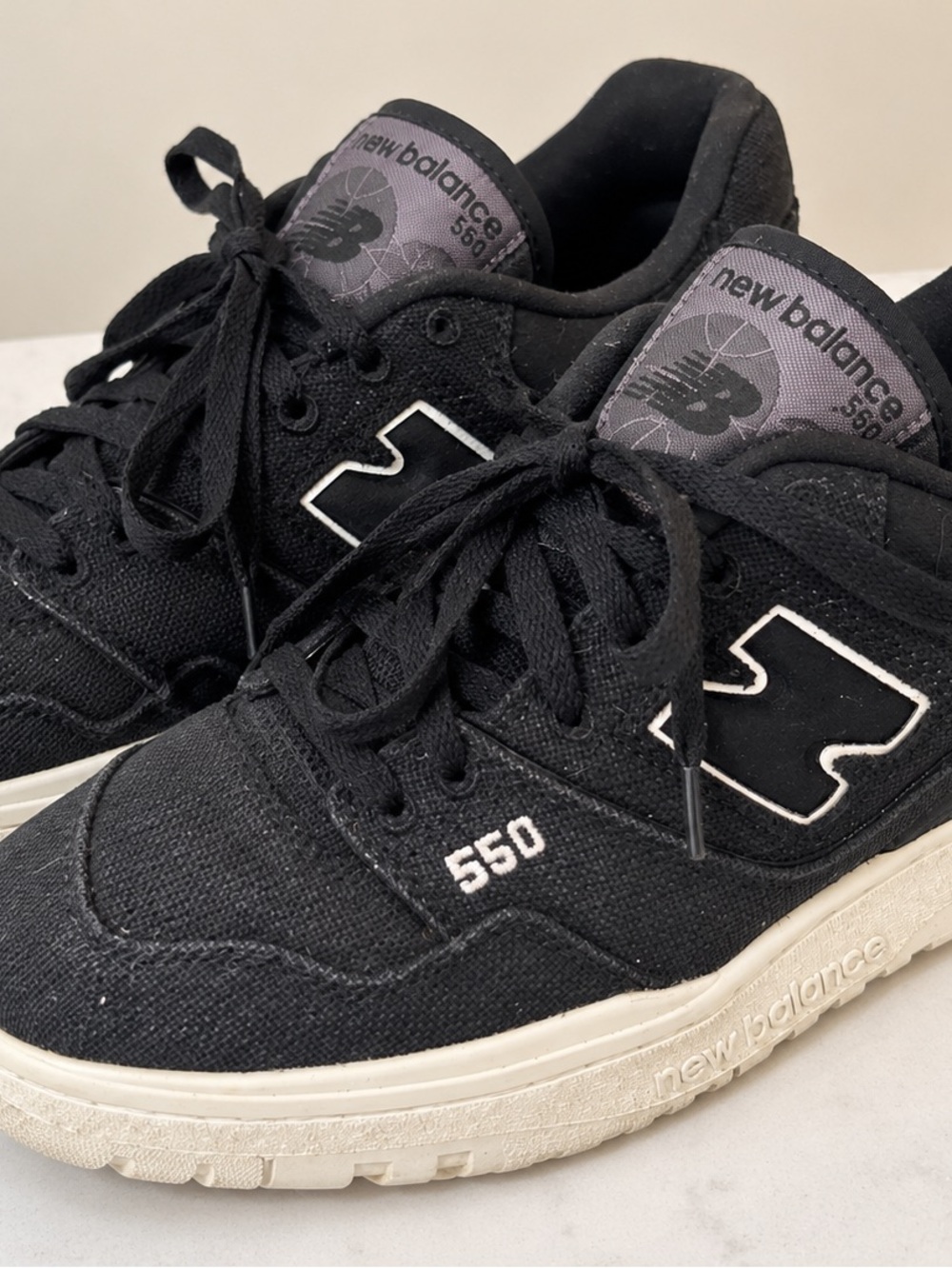 Adult classic new balance 550 sneakers. Material is a canvas type.